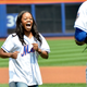 Illustration for article titled Gabby Douglas Seems Far Too Happy to Be Wearing a Mets Jersey